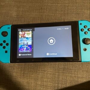 sell nintendo switch wild cat bundle /blue controllers used but works
